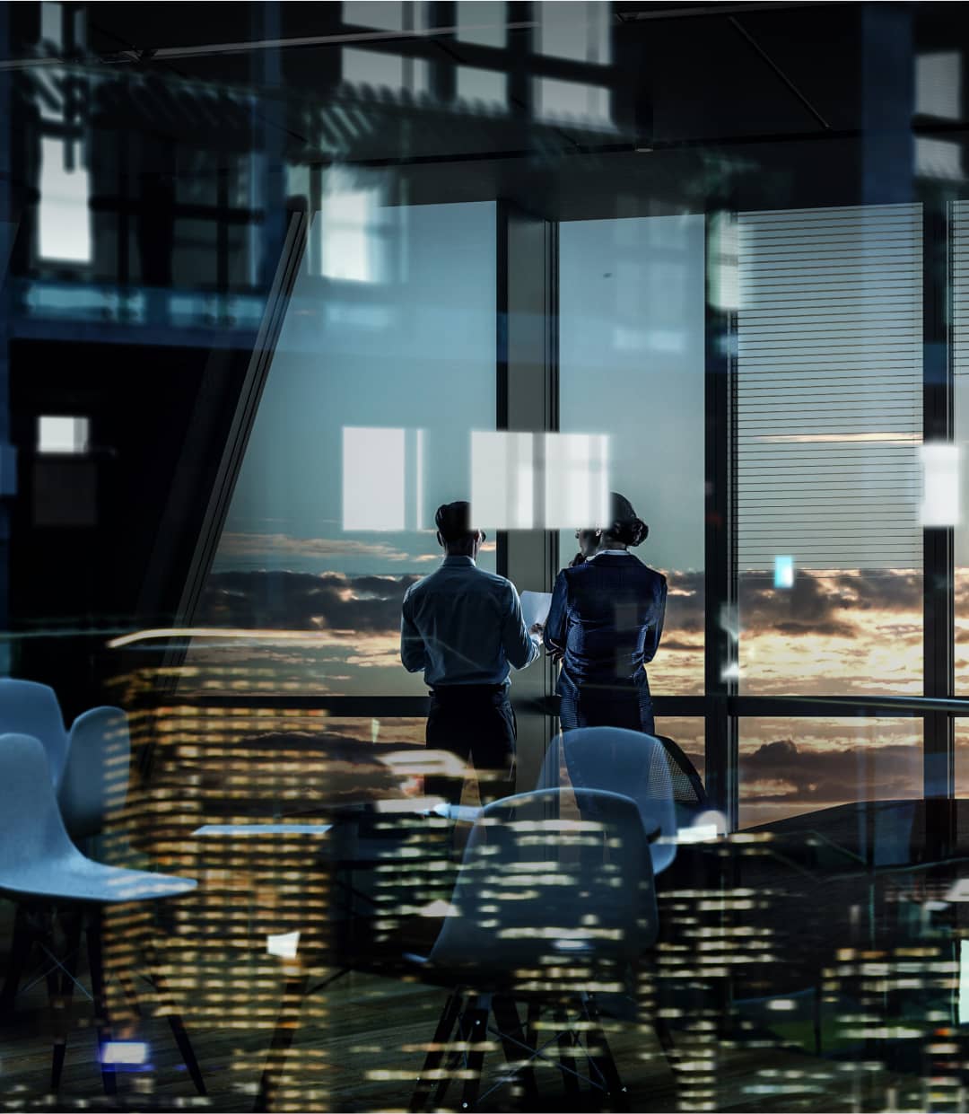 a couple of men standing in front of a window.